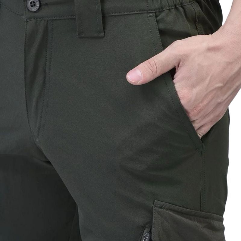 Green men's nylon lycra stretchable cargo pants by Indian Sports Gear, featuring a relaxed fit and multiple utility pockets.