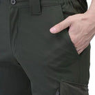 Green men's nylon lycra stretchable cargo pants by Indian Sports Gear, featuring a relaxed fit and multiple utility pockets.
