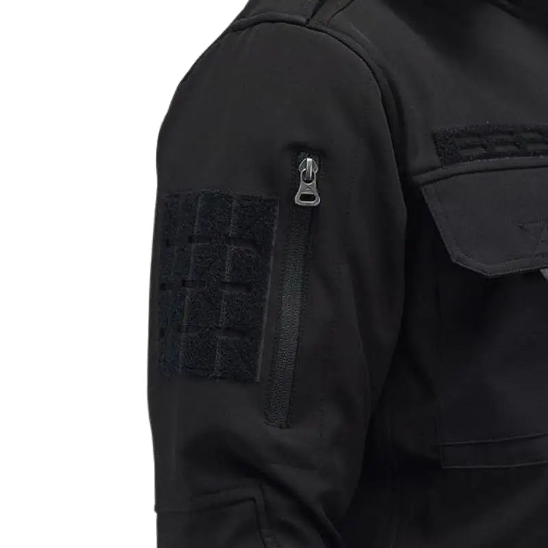 Indian Sports Gear men's tactical soft shell wind jacket in black, windproof and water-resistant, suitable for outdoor activities.