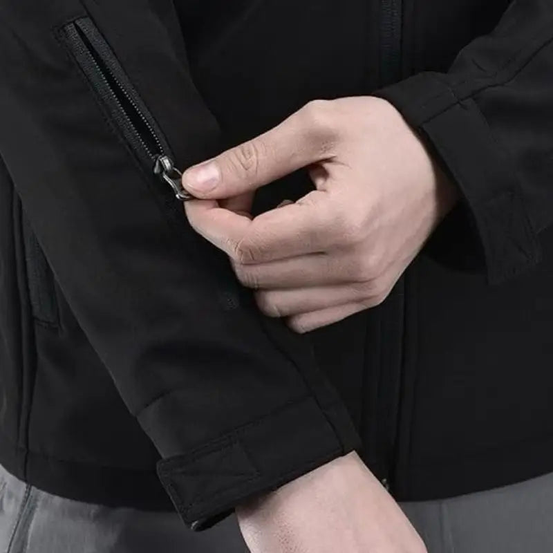 Indian Sports Gear men's tactical soft shell wind jacket in black, windproof and water-resistant for outdoor activities.