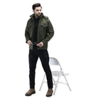 Indian Sports Gear men's tactical soft shell wind jacket in green, windproof and water-resistant for outdoor activities.