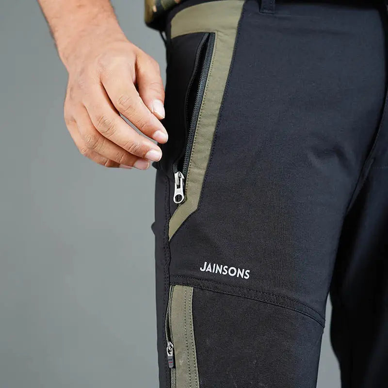 JAG Men's Delta 2.0 black convertible trekking and hiking pants with six cargo pockets, designed for outdoor adventures