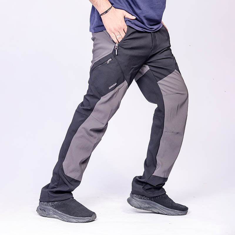 JAG Men's Tactical Pro Series hiking and trekking cargo pants with multiple pockets, durable fabric, and adjustable waist for outdoor adventures.