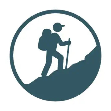 A minimalist teal silhouette of a hiker with a backpack and trekking pole ascending a hill, enclosed within a circular frame.