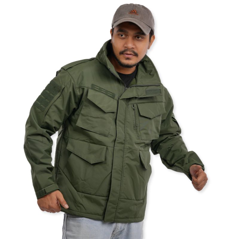 Men's olive green utility jacket by NLTW with box pockets, shown on a hanger. Durable jacket with multiple utility pockets.