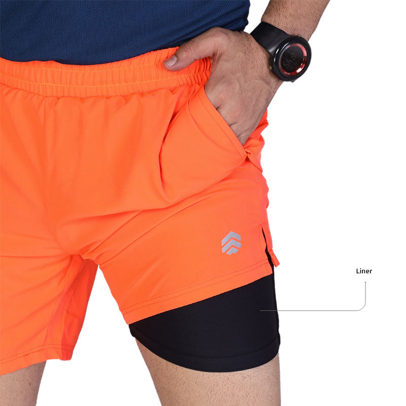 Ruggd Indian men's running shorts with multiple pockets and liner, lightweight activewear in orange, designed for comfort and mobility.