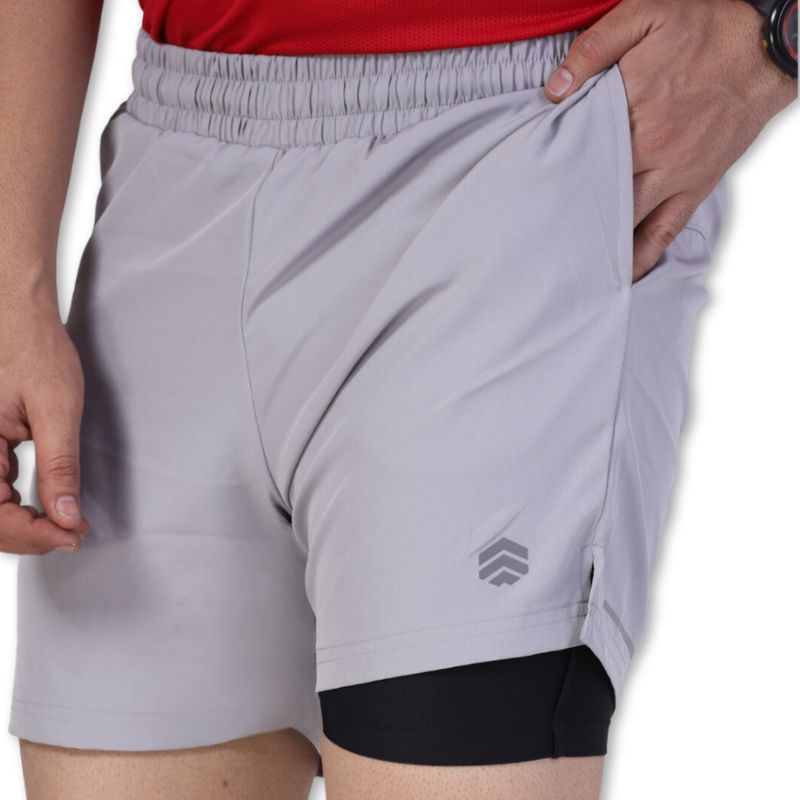 Gray Ruggd Indian men's running shorts with multiple pockets and built-in liner, designed for active and comfortable movement.