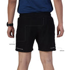 Black Ruggd Indian men's running shorts with multiple pockets and built-in liner, designed for active and athletic use.