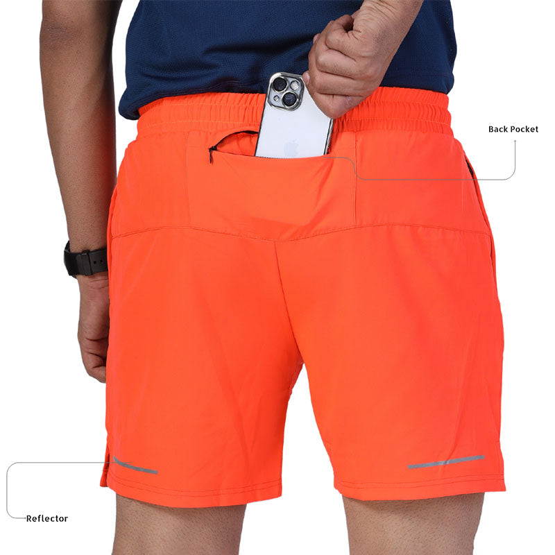 Ruggd Indian men's running shorts with multiple pockets and liner, featuring a lightweight, activewear design in orange.