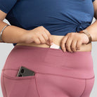 Ruggd Indian women's all-in-one training leggings in orange, showing a form-fitting design with a high waistband and sporty style.