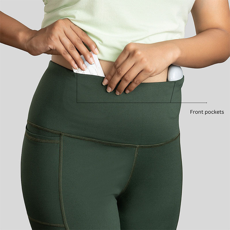 Ruggd Indian women's all-in-one training leggings in black, with a close-up of the stretchy fabric and sleek design.