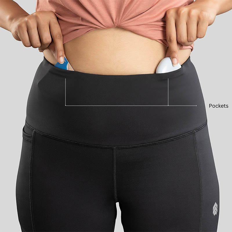 Ruggd Indian women's all-in-one training leggings in black, showing a close-up of the stretchy, form-fitting fabric.