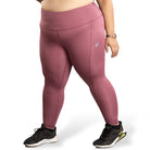 Ruggd Indian women's all-in-one training leggings in vibrant orange, featuring a snug fit and flexible fabric for active wear.