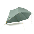Three-person Sea to Summit Ikos TR3 tent set up outdoors, showcasing its lightweight design and durable fabric in a natural environment.