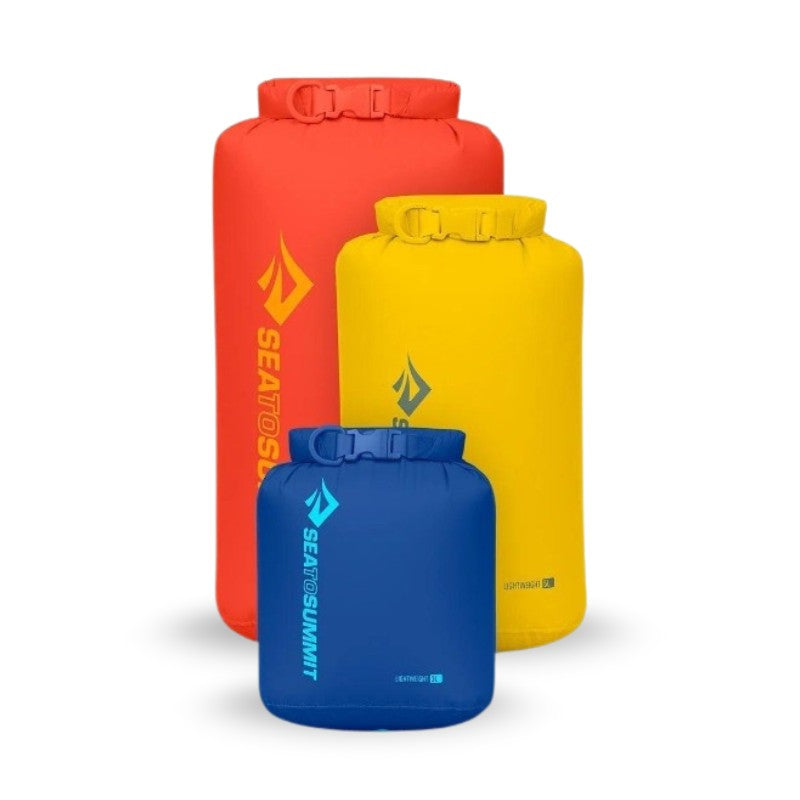 Sea to Summit 3-piece lightweight dry bag set in red, with 3, 5, and 8-liter sizes for waterproof storage during outdoor activities.
