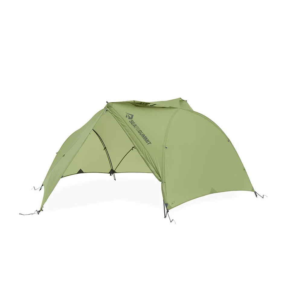 Green Sea to Summit Telos TR2 Plus two-person freestanding tent set up outdoors with rainfly and mesh panels for ventilation.