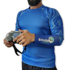 Juvenile angelfish swimming underwater with a men's Shark Mate full sleeve UV rash guard T-shirt for water sports.