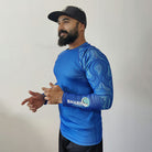 Juvenile angel fish swimming near a Shark Mate men's water sports UV rash guard T-shirt, full sleeve design, suitable for water activities.