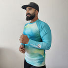 Shark Mate men's water sports UV rash guard T-shirt in shades of ocean blue, full sleeve design for sun protection and active wear.