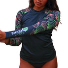 Shark Mate Women's Water Sports UV Rash Guard T-shirt with long sleeves, designed for beach and water activities.