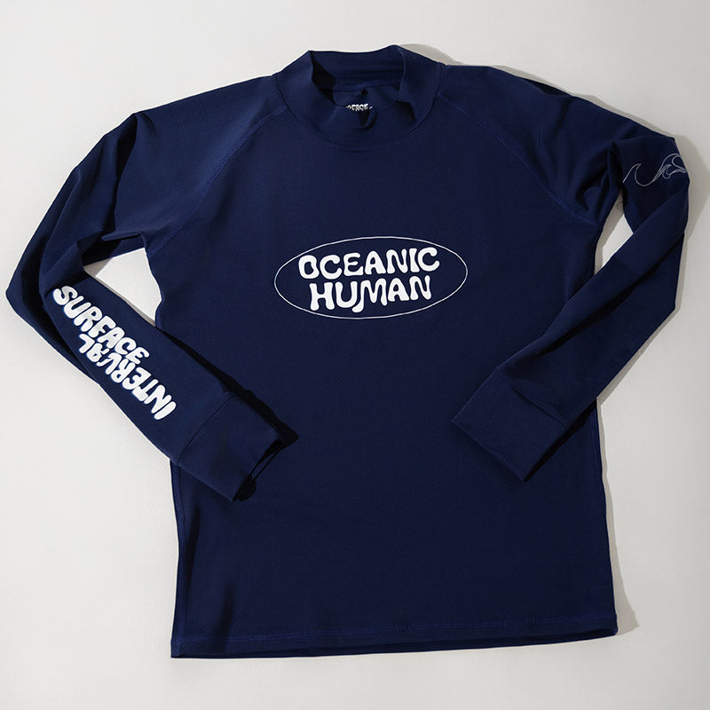 Surface Interval Women's Oceanic human rash guard T-shirt with full sleeves in navy blue, designed for sun protection and active wear.