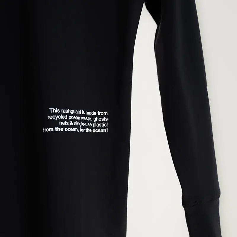 Surface Interval Women's Oceanic human rash guard full sleeve T-shirt in black, designed for water activities and sun protection.