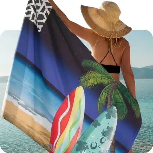 A vibrant beach towel featuring a tropical scene with surfboards, palm trees, and ocean waves in shades of blue, red, yellow, green, and black.